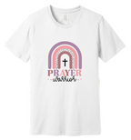 White t-shirt with rainbow and cross design on a wooden background