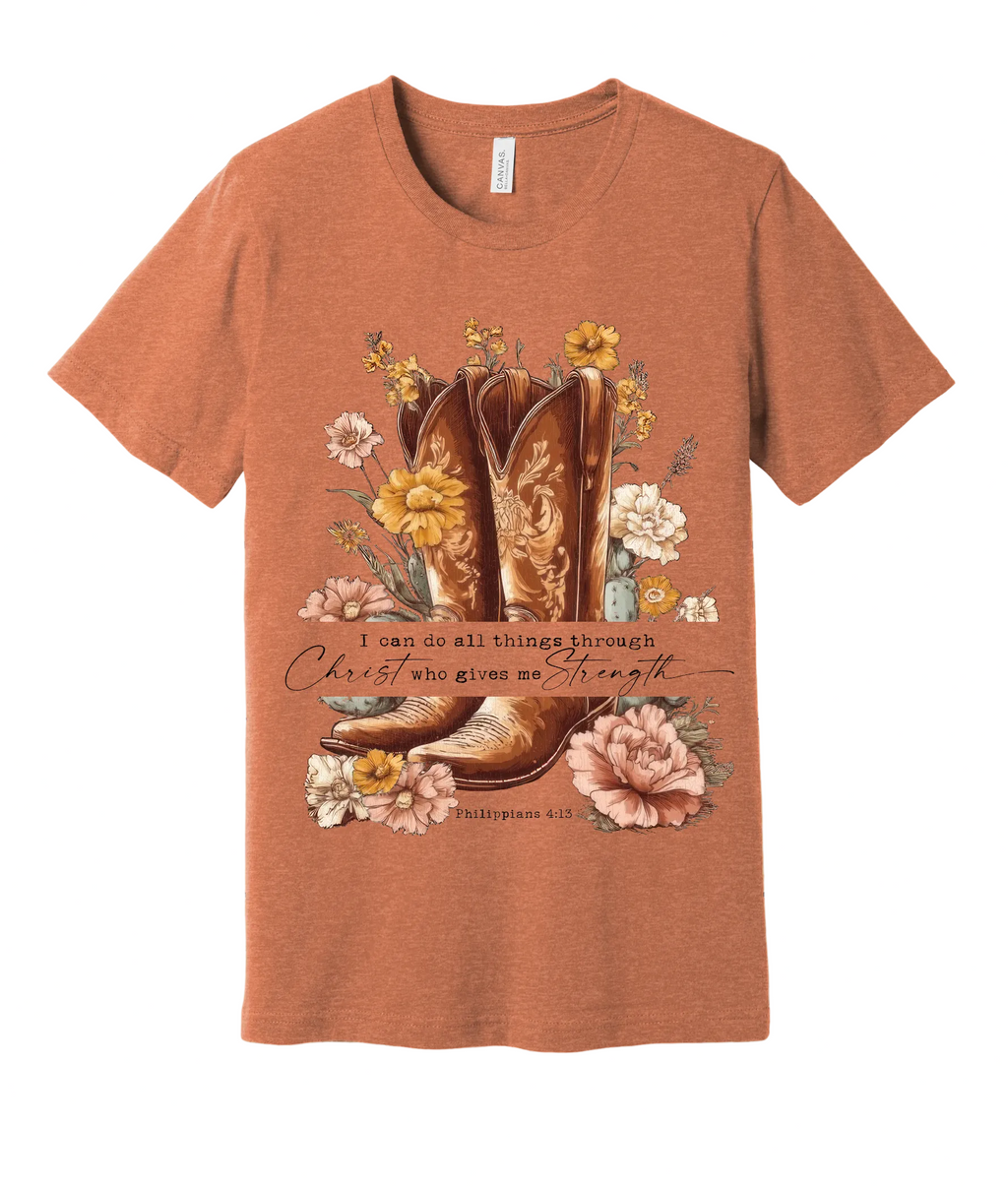 Copper t-shirt with cowboy boot and floral design on a wooden background